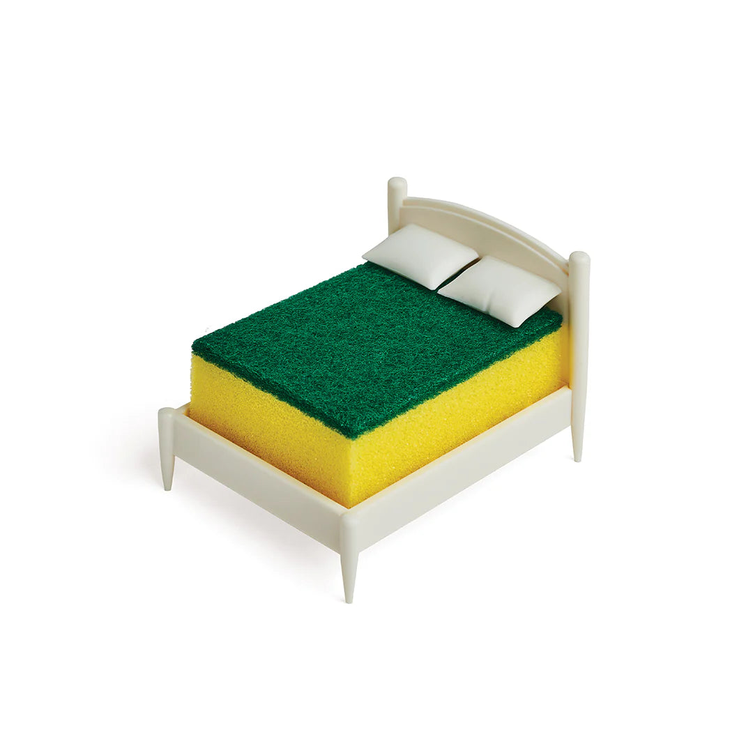 A small bed with a mattress similar to the Clean Dreams sponge, with a green top and yellow base.