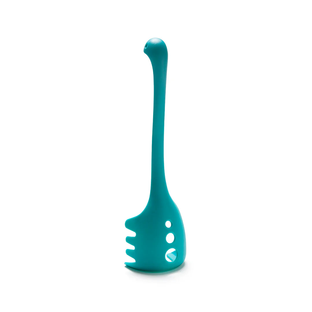 Teal OTOTO Papa Nessie pasta server, dinosaur-shaped with a long neck and side holes, stands upright.