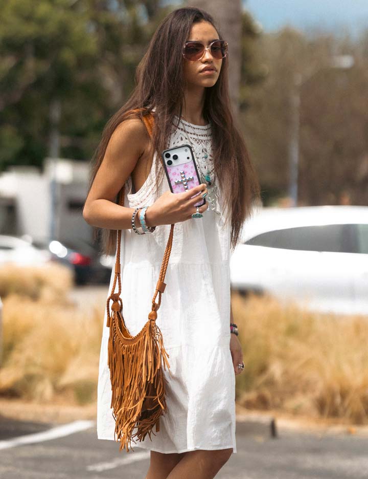 Lifestyle Image 02 Stud Cross Forget Me Not Floral Pink iPhone Case