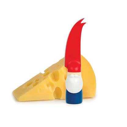 Bert cheese knife, shaped like a gnome, sits on a white background with a cheese wedge.