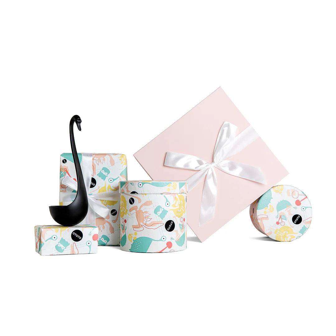 Swanky abstract design gift boxes feature a floating ladle with one box adorned with a ribbon.