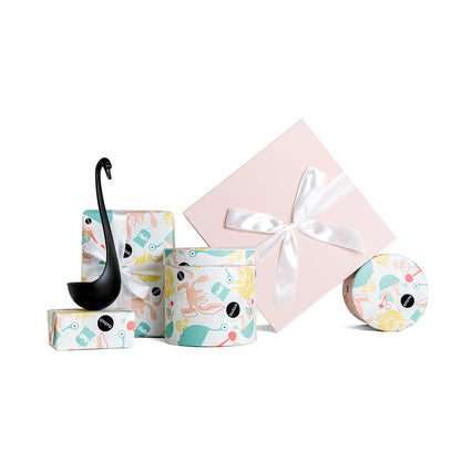 Swanky abstract design gift boxes feature a floating ladle with one box adorned with a ribbon.
